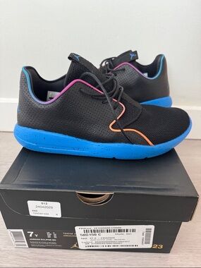Jordan Black Sneakers with Bright Blue Soles and Pink & Orange Accents